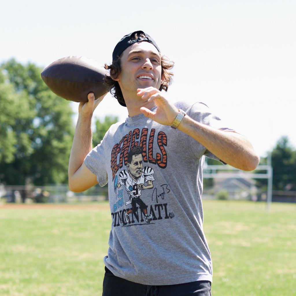 Youth Peanuts x Cincinnati Bengals Joe Cool Burrow Youth T-Shirt from Homage. | Officially Licensed Vintage NFL Apparel from Homage Pro Shop.